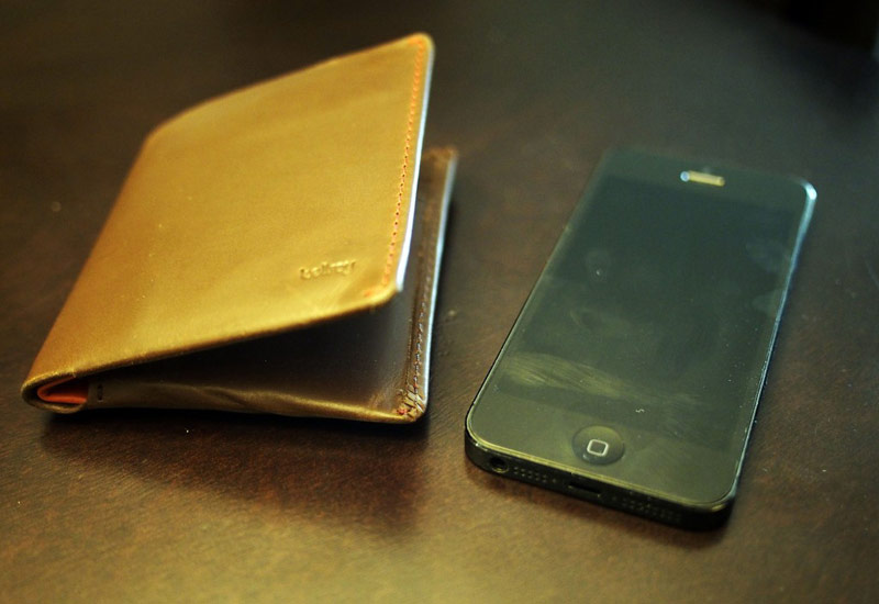 'Note Sleeve' Wallet next to an iPhone 5